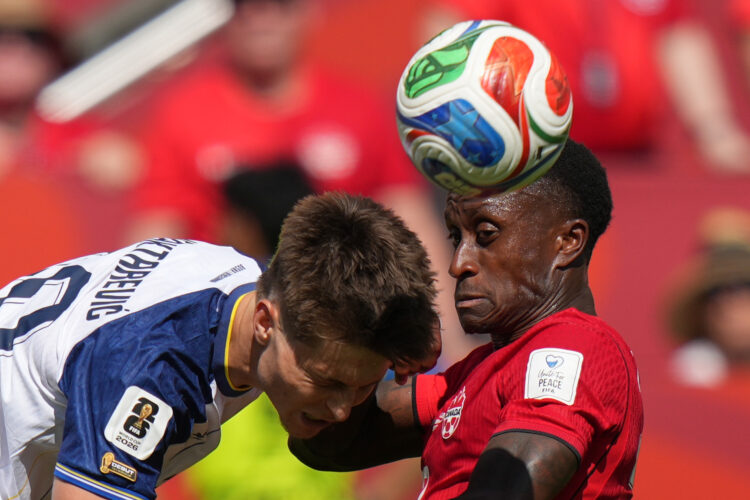 Canada rallies down the stretch for tie at World Cup